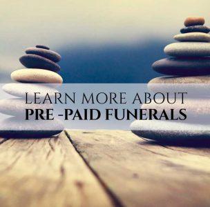 Learn more about Pre-paid funeral text with Stone cairn in background